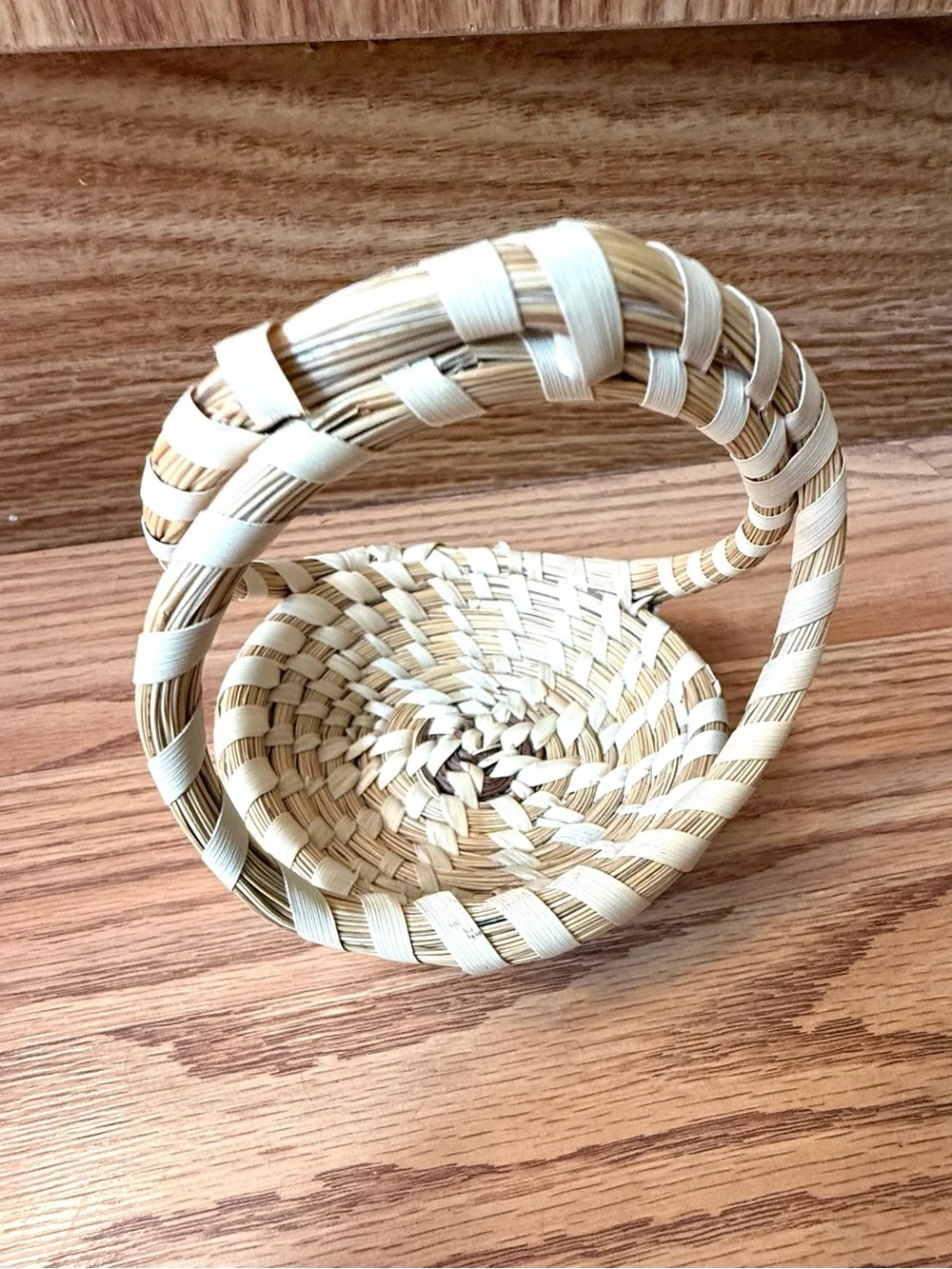 Atraditional hand-woven sweetgrass basket